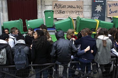 French high school students block the access of the Arago high school in Paris