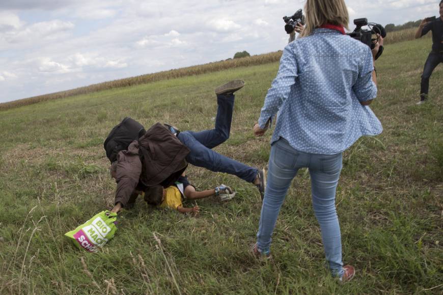 hungary camerawoman trips migrant