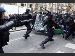 Youths clash with riot police officers during a high school students demonstration against a labor reform, in Paris, Thursday, March 24, 2016. France's Socialist government is due to formally present a contested labor reform that aims to amend the 35-hour workweek and relax other labor rules.(AP Photo/Francois Mori)/XFM101/636098245336/1603241425